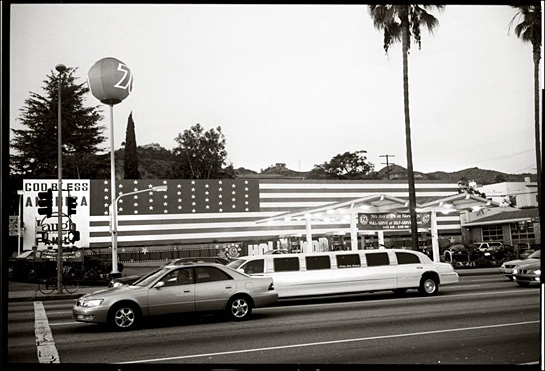 Stretch limo and long flag